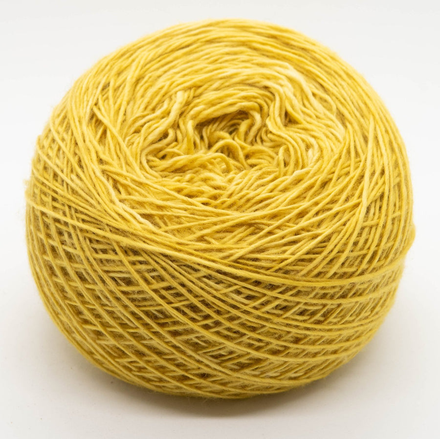 Naturally dyed merino/ cashmere/ silk blend singles yarn in warm yellow