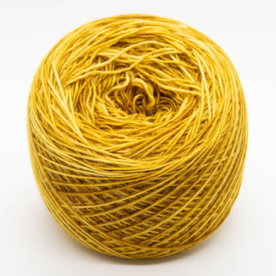 Naturally dyed merino/ cashmere/ silk blend singles yarn in gold